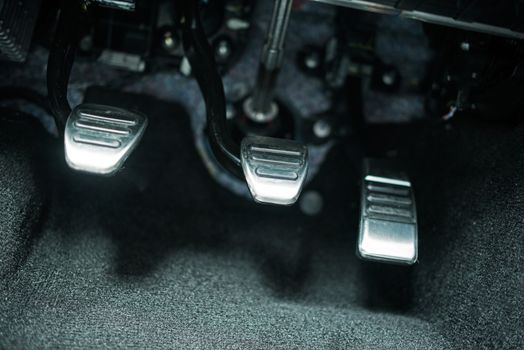 Car Pedals. Modern Car Clutch, Gas and Brake Pedals Closeup.