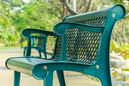 Chairs in the garden. Highlight objects in the image. Is chair of the Health Park