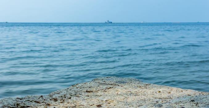 Rocks sea. Focus rocky sea blurred background.