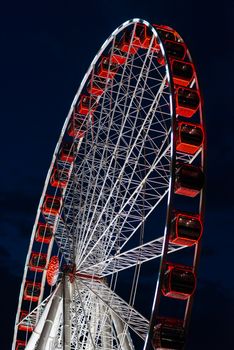 Ferriss wheel at night, close up view