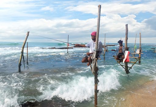 Local fishermen on stick in indian ocean, Sri lanka