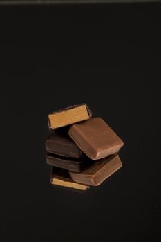 chocolate candies on a reflective glass