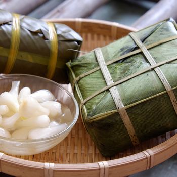 Vietnamese food for Tet holiday in spring, banh chung is traditional food on lunar new year, a rice cake stuffed with pork, green bean, is tradition culture in spring