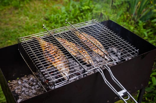 The fish is fried on the grill