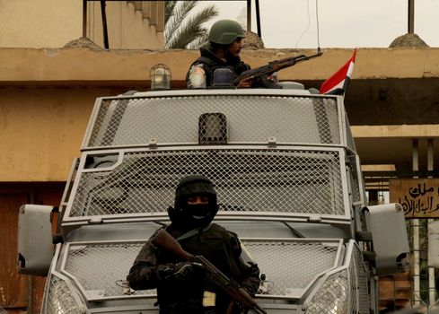 EGYPT, Cairo: Members of the Central Security Forces patrol in Cairo, on January 25, 2016, on the 5 year anniversary of the 2011 uprisings. Tahrir Square saw a large security presence, after armed clashes broke out the previous two years between police and demonstrators.