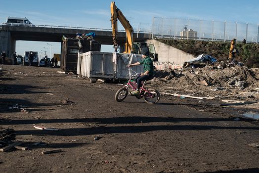 FRANCE, Calais: French riot police patrol on January 25, 2016, in a zone where makeshift shelters were cleared from in the migrant shantytown on the outskirts of Calais known as the Jungle, where thousands are trying to make their way across the English Channel.A prefectoral decree posted on January 19, 2016, gave people 24 hours to leave the premises of a 100-metre-wide strip of land in the jungle, where several small food businesses and restaurants had been set up, before its evacuation and destruction.