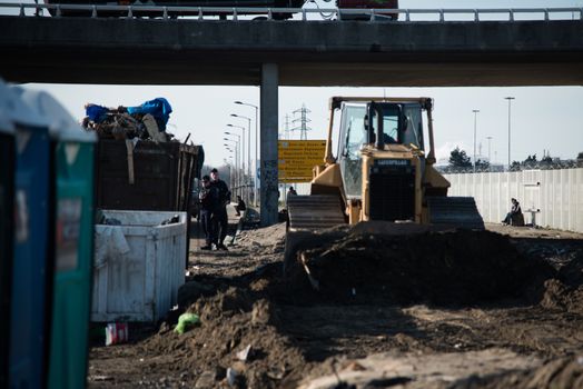 FRANCE, Calais: A bulldozer demolishes part of the Jungle in Calais, northern France on January 25, 2016.