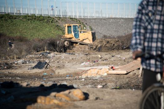 FRANCE, Calais: A bulldozer demolishes part of the Jungle in Calais, northern France on January 25, 2016.