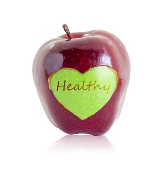 green apple heart shape in red apple with healthy text isolated on white background. Save clipping path.