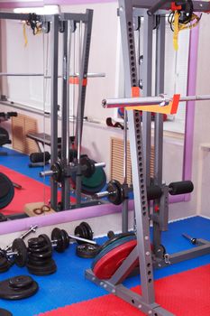 Healthy lifestyle symbol. Gym hall interior with equipment