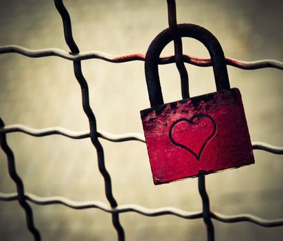 background retro red lock locked on the fence
