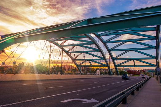 Speer Boulevard Bridge at Sunset. Bridge Traffic. City of Denver, United States.