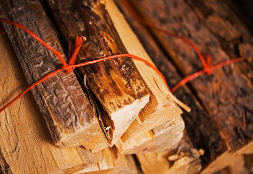 Bundles of Pine Firewood Closeup Photo. Fireplace Wood.