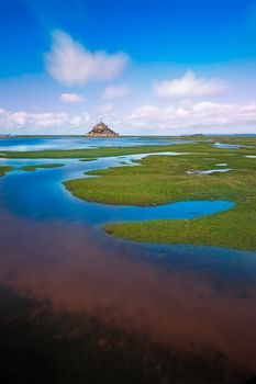 Mont Saint-Michel with clouds at a sunny day, Normandy, France