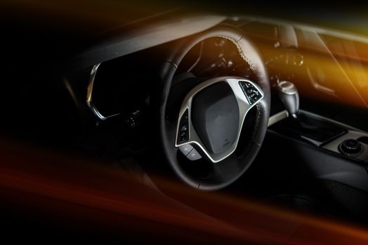 Dark Black Modern Super Car Cockpit with Reddish Light Rays.