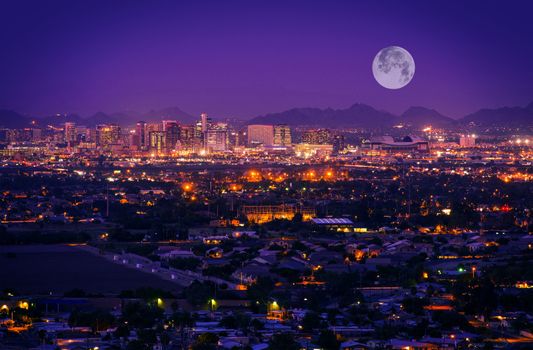 Phoenix Arizona Skyline at Night. Full Moon Over Phoenix, Arizona, United States.