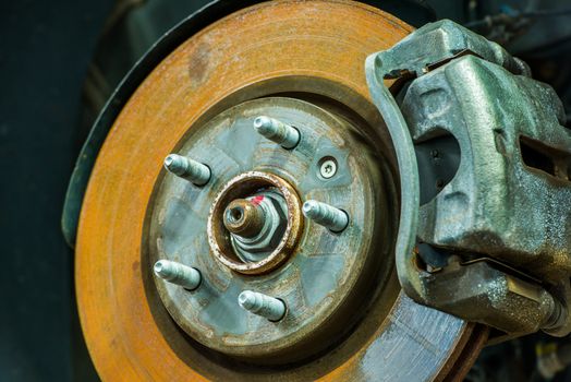 Rusty Car Disc Brake Closeup Photo. Servicing Car Brakes.