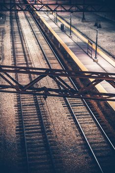 The Railroad Station at Night. Vertical Photography. Railroad System.