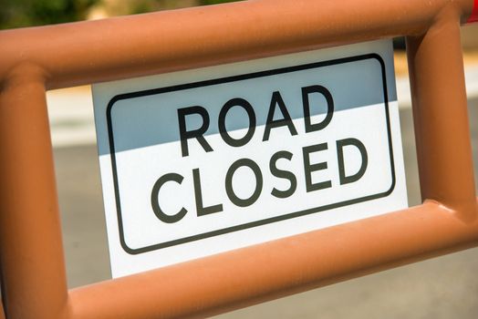 Road Closed Sign on the Metal Gate. Sign Closeup.