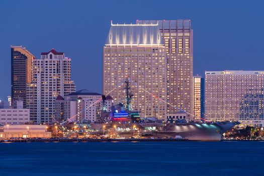 USS Midway and San Diego. USS Midway Aircraft Carrier Museum and San Diego Skyline at Night. California USA.