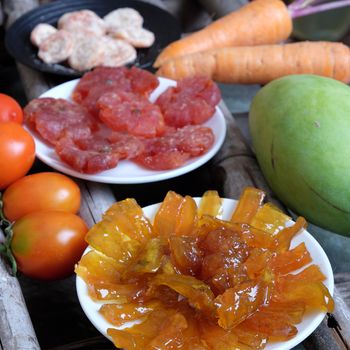 Vietnamese food for Tet holiday in spring, mango jam, sweet eating is traditional food on lunar new year, can make from mango fruit cook with sugar,  amazing background for Vietnam culture