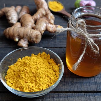 Turmeric powder with bee honey, agriculture product, nutrition, healthy food, natural cosmetic for beauty care, can treat stomach ache, also is spice for food,  aromatic flavor, organic yellow color