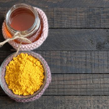 Turmeric powder with bee honey, agriculture product, nutrition, healthy food, natural cosmetic for beauty care, can treat stomach ache, also is spice for food,  aromatic flavor, organic yellow color