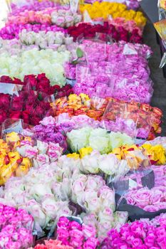 Beautiful different Bouquets of roses in front of a flower shop.