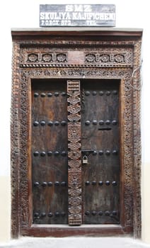 Old wooden door at Stone Town the capital of Zanzibar island East Africa.