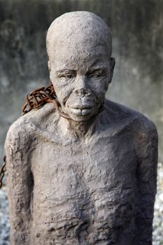 A statue in Stone Town, Zanzibar dipicting and mourning the African slave trade