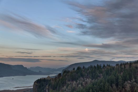 Full Moon Rising over Crown Point in Columbia River Gorge Oregon at twilight