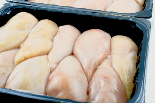 Raw chicken breast 5 kg in plastic container
