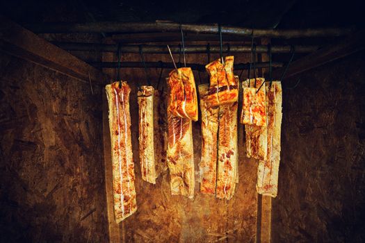 Home made ham in the smoke house in rural Romania