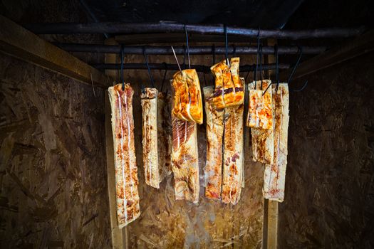 Home made ham in the smoke house in rural Romania