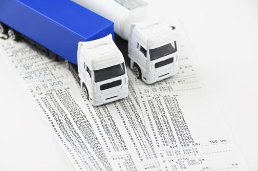 Digital tachograph printed day shift against two lorry

