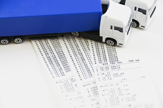 Digital tachograph printed day shift against two lorry

