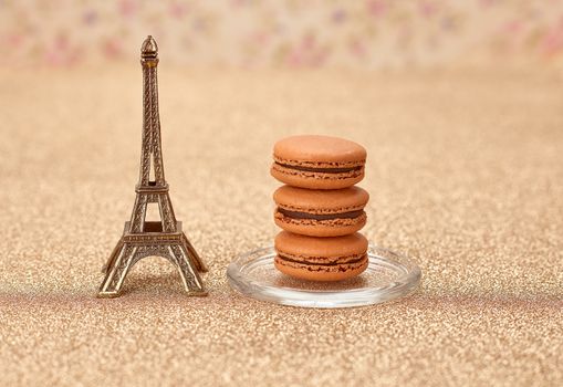 Macarons french dessert. Eiffel Tower, souvenir from Paris. Fresh dessert chocolate, vintage retro romantic style.Unusual creative art greeting card, shiny floral background,bokeh