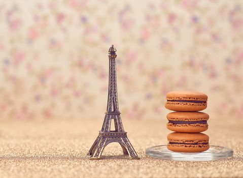 Macarons french dessert. Eiffel Tower, souvenir from Paris. Fresh dessert chocolate, vintage retro romantic style.Unusual creative art greeting card, shiny floral background,bokeh
