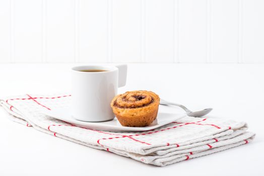 Fresh baked cinnamon rolls served with coffee.