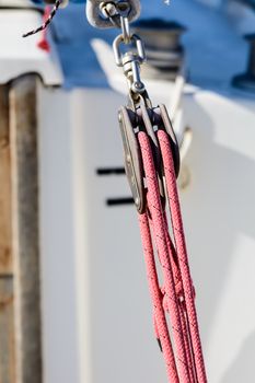 Fragmentary view details of knots and ropes on the yacht moored in the dock