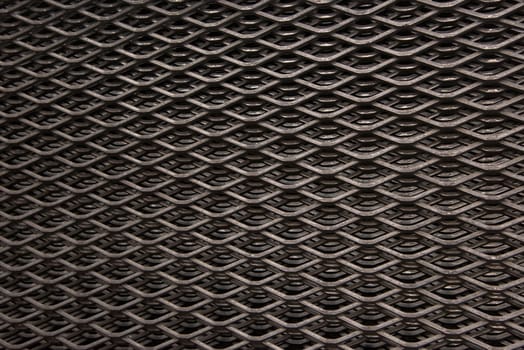 Stack of industrial steel grids with several layers of grids visible.
