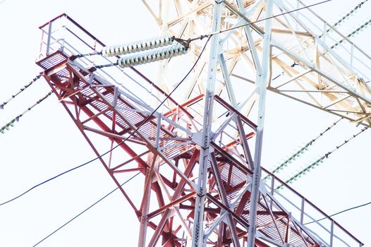 High-voltage power lines against the sky