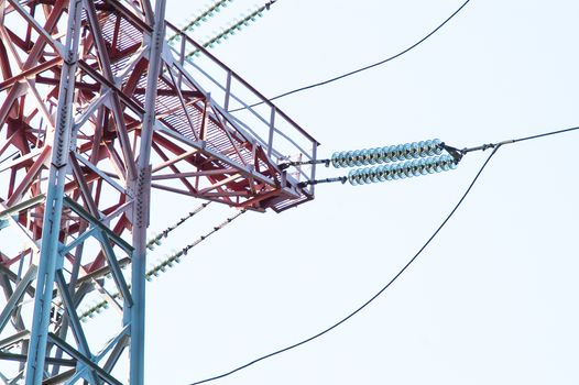 High-voltage power lines against the sky