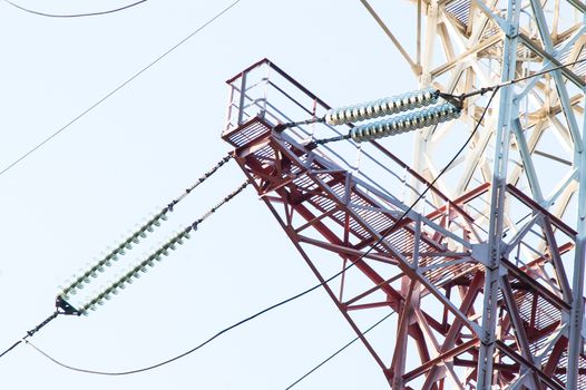 High-voltage power lines against the sky