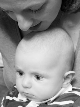 Beautiful newborn baby boy with his mother, complicity, happiness, black and white