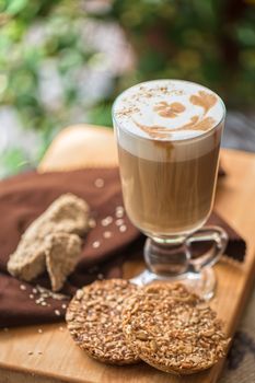 coffee latte cup with cookies closeup