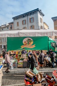 Vertical shot of a fruit / veg vendor in Cremona, Italy, street market. January 2016