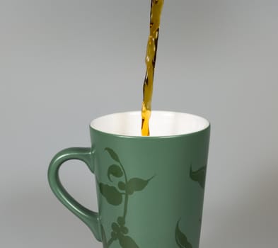 Coffey Pouring in to Cup close up image.