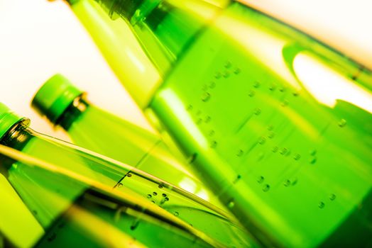 Mineral Water Green Bottles Closeup. Sparkling Water.