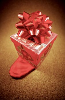 Tiny Gift Box with Red Bow on the Top. 